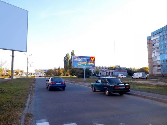 Фото рекламной плоскости по адресу вул. Юрія Кондратюка, 32, автомийка /ул. Коммунаровская, 32, автомойка, McDonald's, станция метро Покровская, рынок