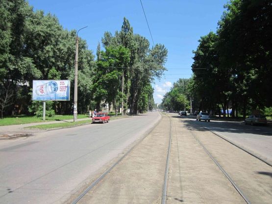 Фото рекламной плоскости по адресу вул.Б.Хмельницького, 130/ул.Героев Сталинграда, 130, ТЦ Терра, рядом рынок, магазины