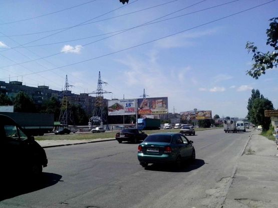 Фото рекламной плоскости по адресу Донецьке шосе - вул.Березинська (перед поворотом на ТЦ "Караван")/Донецкое шоссе - ул.Березинская (перед поворотом на ТЦ"Караван") поток движения в центр, правая сторона Фото рекламной плоскости по адресу Донецьке шосе - вул.Березинська (перед поворотом на ТЦ "Караван")/Донецкое шоссе - ул.Березинская (перед поворотом на ТЦ"Караван") поток движения в центр, правая сторона