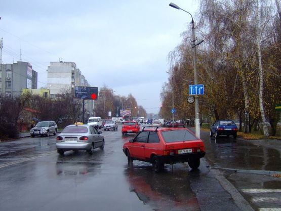 Фото рекламной плоскости по адресу вул.Прибузька біля нового мосту на "Эпицентр". неподалік: "Епіцентр", супермаркет "Таврія В", "Сільпо", ТРЦ "Оазис", центральний ринок, елітна забудова "Набережний квартал", "Атлант" (центр)