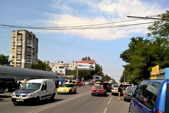 Фото рекламной плоскости по адресу просп. Бочарова / ул. Добровольского (рынок "Северный")