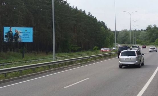 Фото рекламної площини за адресою Минский пр-т/ 2 км до перекрестка,направо на Н.Петривцы,Дымер,налево,на пл.Шевченко (В)