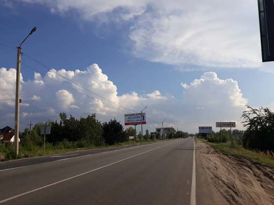 Фото рекламной плоскости по адресу трасса Р69 с.Хотяновка,магазин Фора, выезд из села, направление в Вышгород,Киев