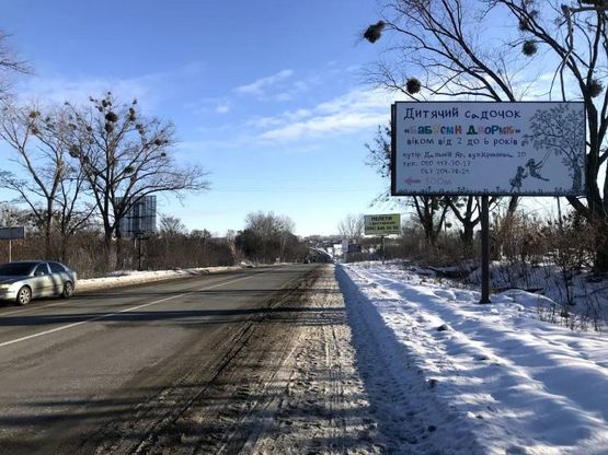 Фото рекламной плоскости по адресу А-д P04 , после магазина "Парирус"