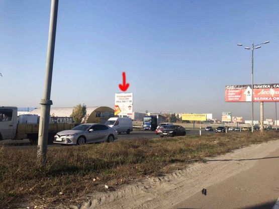 Фото рекламной плоскости по адресу Софиевская Борщаговка, Кольцевая дорога,на пересечении с ул.Яна Качуры перед выездом на Жулянский мост