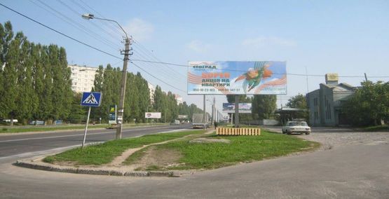 Фото рекламной плоскости по адресу м. Рівне вул. Шухевича 12, навпроти автозаправки “OKKO” та перехресті вулиць Шехевича/Андрія Мельника, неподалік офісний центр Фото рекламной плоскости по адресу м. Рівне вул. Шухевича 12, навпроти автозаправки “OKKO” та перехресті вулиць Шехевича/Андрія Мельника, неподалік офісний центр