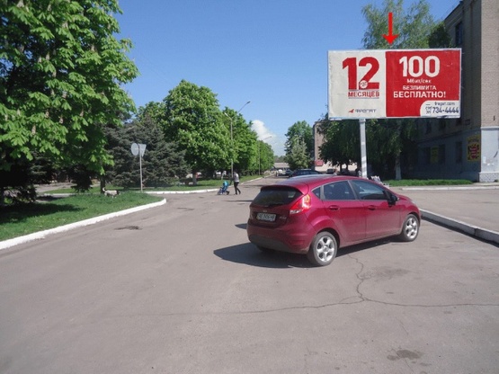 Фото рекламной плоскости по адресу Шахтостроителей пр-т 13, возле супермаркета "КАПИ", в центр