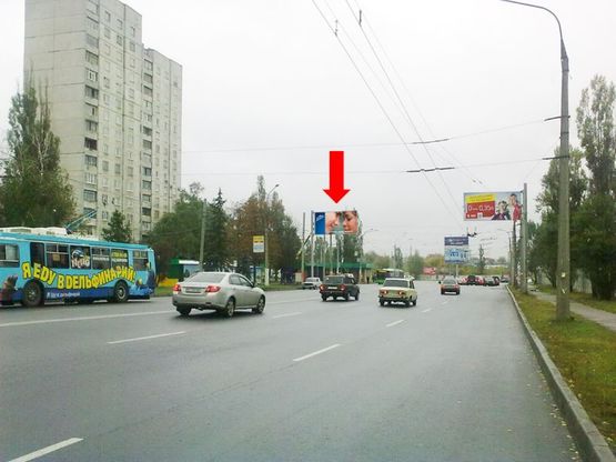 Фото рекламної площини за адресою Юбилейный пр. (бывш. 50 лет ВЛКСМ пр.), 34,  в сторону рынка "Барабашово", центра (флажок) Фото рекламної площини за адресою Юбилейный пр. (бывш. 50 лет ВЛКСМ пр.), 34,  в сторону рынка "Барабашово", центра (флажок)