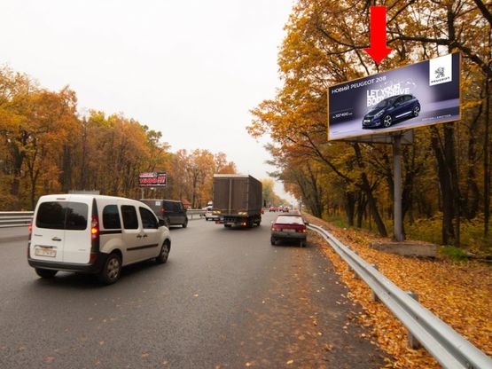 Фото рекламной плоскости по адресу Одесская трасса / Глушкова пр., напротив АЗС "ТНК", в сторону Одесская пл.