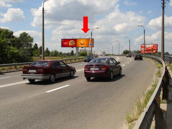 Фото рекламної площини за адресою Новоконстантиновская ул. / Бандеры пр. (бывш. Московский пр.), на мосту, в сторону Автозаводская ул., правая