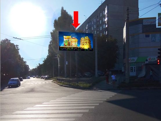 Фото рекламной плоскости по адресу Гвардейцев Широнинцев ул. - ул. Бучмы, возле магазина "Ева", в сторону пр. Тракторостроителей Фото рекламной плоскости по адресу Гвардейцев Широнинцев ул. - ул. Бучмы, возле магазина "Ева", в сторону пр. Тракторостроителей