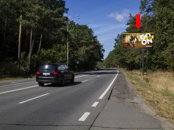 Фото рекламної площини за адресою Столичное шоссе ул., напротив Олимпийского мишки, в сторону Киева