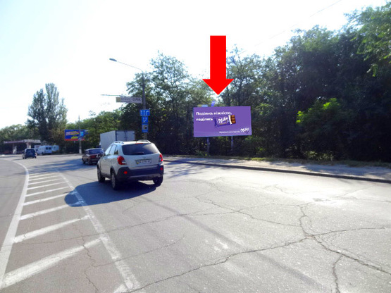 Фото рекламної площини за адресою Героев Сталинграда пр., парк Победы, возле АЗС "Amic", супермаркетов "Амстор", "Praktiker", из центра