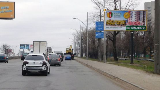 Фото рекламної площини за адресою Кольцевая дорога ул. Зодчих, напротив № 28  в направлении просп. Победы Фото рекламної площини за адресою Кольцевая дорога ул. Зодчих, напротив № 28  в направлении просп. Победы